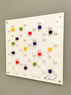 a white board with many different colored squares on it