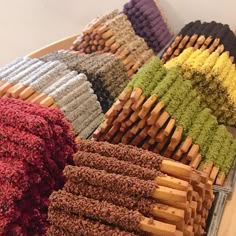 many different colored rugs are arranged on a table