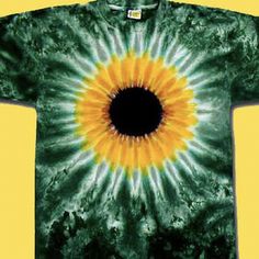 a green and yellow tie - dyed shirt with a black hole in the center