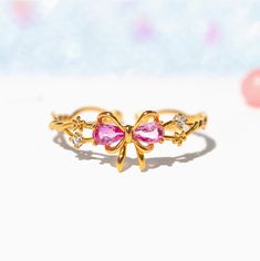 This ring will get you feeling extra pretty in pink! Wrap yourself up in a bow and celebrate the greatest present there is--you! Featuring a delicate intertwining band and dazzling embellishments, all leading to a perfect pink ribbon. This piece will make you feel like the ultimate gift! Cute Gold Rings Kids, Pretty Rings Paper, Rings Kids Jewelry, Disney Rings, Popular Earrings, Pink Wrap, Flat Back Earrings, Handmade Jewelry Tutorials, Bow Ring