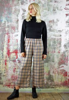 Cropped Trousers in Beige Check   Tartan crop pants, deets include:beige check fabric(with white and black)with a slightly cropped length and an exposed black elastic waist. Designed and made in our UK studio (customise the length for free) also available as a co-ord, in other colours and the fabric is available in other styles (including cargo pants and shorts) Last pic shows the blue and pink fabrics available. Relaxed Fit Plaid Pants With Elastic Waistband, Plaid Straight Pants For Spring, Plaid Relaxed Fit Trousers, Plaid Relaxed Fit Pants, Plaid Relaxed Fit Straight Pants, Plaid Straight Pants With Relaxed Fit, Plaid Trousers For Spring, Relaxed Fit Plaid Straight Pants, Relaxed Fit Plaid Trousers