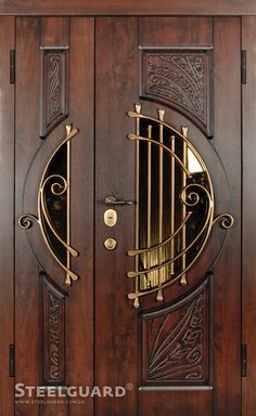 an ornate wooden door with metal bars on the top and side panels, which are open