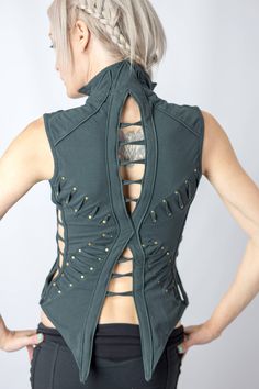 Embrace your inner sacred self with our curve-hugging paneled vest that brings the flower of life geometry alive. Brass grommet accents and delicate lace inserts give this unique design a subtle grace and beauty. Our Mandala Vest can be worn on its own or as an additional layer. A perfectly placed infinity closure allows this vest to double as a bustier that accentuates your irresistible curves. Sizing follows bra size: 32a or b = xs, 32c+ = S 34=M 36=L Womens Steampunk Vest, Burning Man Dress Women, Luxury Bohemian Festival Vest, Cheap Festival Vest Tops, Man To Woman Transformations Dresses, Structured Fashion, Armor Clothing, The Flower Of Life, Lace Booties