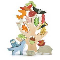 a wooden tree with animals and leaves on it