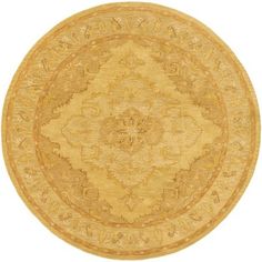 a round rug with an intricate design on the center and sides in gold tones, isolated against a white background