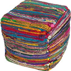 multicolored woven poufce with tassels and beads on white background