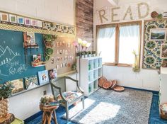 a room with many pictures on the wall and a blue rug in front of it