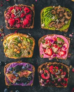 four slices of toast with different toppings on them, all topped with fruits and vegetables