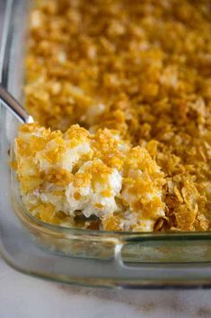 a casserole dish filled with cheese and other toppings, ready to be eaten