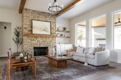 a living room filled with furniture and a fire place