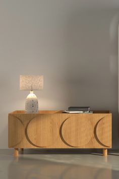 a wooden table with a lamp on top of it