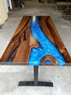 a wooden table with blue paint on it