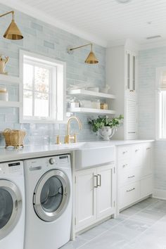 a washer and dryer in a white kitchen