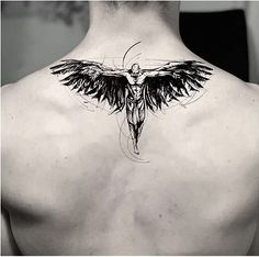 the back of a man's neck with an angel tattoo on it