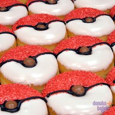 there are many heart shaped donuts with red sprinkles on them and white frosting