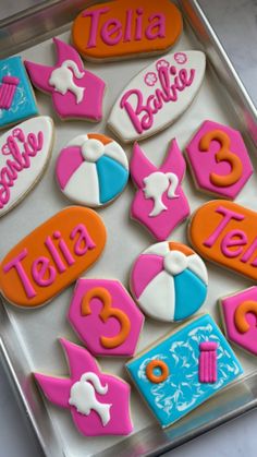 decorated cookies in the shape of beach balls and umbrellas