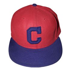 a red and purple baseball cap with the letter c on it's front side