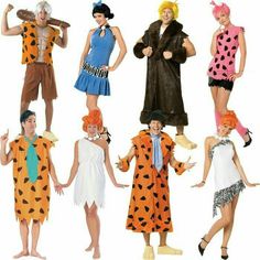 six people in costumes are posing for a photo together, all dressed up as flint and the flintstones