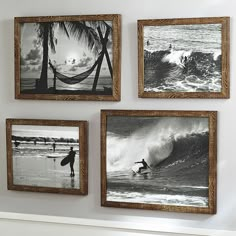 four framed pictures hang on the wall above a fireplace