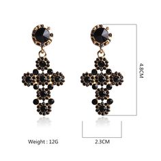 These exquisite BOHO Full Crystal Rhinestone Gothic Cross Drop Dangle Earrings offer an air of sophistication and elegance with their classic gothic cross design, richly finished with a full color crystal and rhinestone inlay. An ideal choice for a stylish and tasteful look with an unmistakable touch of refined luxury. Available in two different colors. Details Item Type: Fashion Earrings Metal Type: Zinc Alloy Material: Acrylic,Rhinestone Size: 4.8*2.3cm Back Finding: Push Back Gothic Cross Pendant Jewelry For Party, Gold Gothic Earrings For Parties, Black Ornate Dangle Jewelry, Elegant Black Crystal Rhinestone Earrings, Black Cross Metal Earrings, Black Metal Cross Earrings, Black Gothic Cross Earrings, Goth Cross Earrings, Gothic Cross-shaped Pierced Earrings