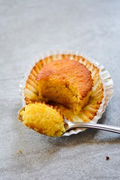 a half eaten cupcake sitting on top of a table