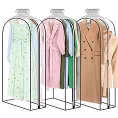 three racks with coats and dresses hanging on them in front of a white background,