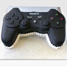 a cake shaped like a video game controller