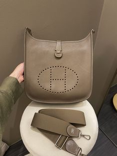 Hermes Evelyne 29 PMEtoupe Clemence PHWSize 29 x 30 x 8 cmAdjustable strapR stamp 20149/10 Great (minor faint pocket interior scratch and inevitable signs on hardware. Almost clean front and back. Structure intact)Includes full set box, dust bag and receiptPrice now 3100 sgd 2320 usd CN4903-03 Louis Vuitton Shoes, Dior Shoes, Full Set, Designer Dresses, Bags Designer, Dust Bag, Stamp, Signs