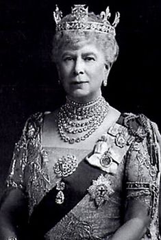 an old black and white photo of a woman wearing a tiara with jewels on it