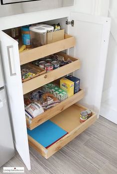 an open refrigerator door with some food in the bottom shelf and other items on the bottom shelf