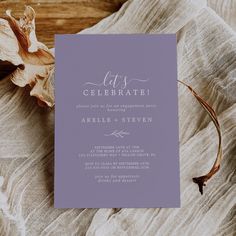 a purple and white wedding card with the words, it's celebrate on it