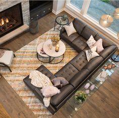 a living room filled with furniture and a fire place