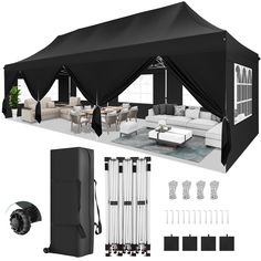 a large black tent with white furniture and accessories around it, along with other items