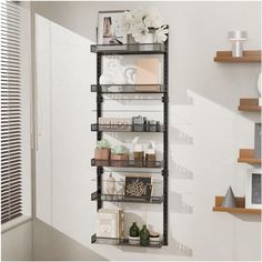 the shelves are holding various items and flowers