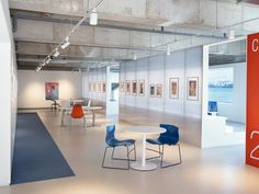 an empty room with tables and chairs in it