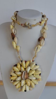 Massive vintage one of a kind handmade Papua New Guinea tiger shell & yellow Money Cowrie shell & other rare shells statement necklace with huge rosette flower pendant - no clasp  good condition 31 inches inner size; pendant: 4 inches diameter Thank you for watching my other items! similar items are listed and much more to come! Combined shipping available where possible -please contact us for details before buying the items. Handmade Mother Of Pearl Shell Necklaces, Handmade Shell Pendant Necklace, Handmade Shell-shaped Mother Of Pearl Necklaces, Unique Handmade Shell Pendant Necklace, Handmade Mother Of Pearl Shell-shaped Necklaces, Unique Shell-shaped Mother Of Pearl Jewelry, Handmade Mother Of Pearl Shell Pendant, Unique Shell Necklace With Mother Of Pearl, Handmade Mother Of Pearl Necklace In Shell Shape