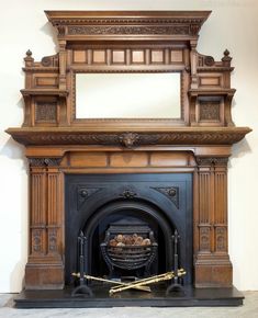 an old fireplace with a mirror above it