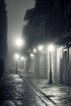 an empty street at night in the rain