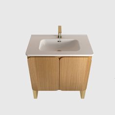 a bathroom sink sitting on top of a wooden cabinet