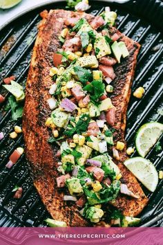 grilled salmon with corn, avocado and cilantro salsa on the grill