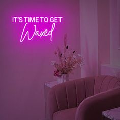 there is a pink neon sign that says it's time to get waxed