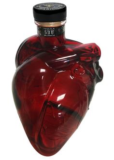 a red glass heart shaped bottle with a black cap on it's top and bottom