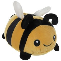 a yellow and black stuffed animal with a bee on it's back