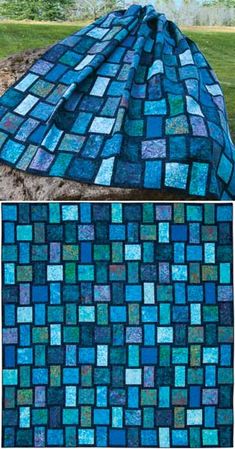 a blue blanket that looks like it has been made out of glass tiles