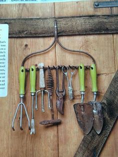 there are many different tools hanging on the wall