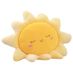 a yellow sun pillow with eyes closed