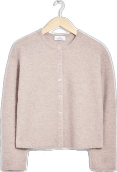 a cardigan sweater with buttons on the front and back, in light beige color