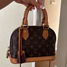 This Louis Vuitton Alma Bb Purse Comes With All Of Its Original Packaging Including The Box Ribbon Which Is Not Pictured. It Has Been Preloved And Stained Over Time. The Leather Can Be Replaced By A Bag Rehab Specialist. The Purse Is Now Priced At $1,820 On Lv’s Website/In Stores. Lv Bb Alma, Alma Bb, Louis Vuitton Monogram, Louis Vuitton Bag, Bag Lady, Louis Vuitton, Monogram, Leather, Color