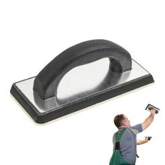 a man is using a stapler to hold something in one hand and an object in the other