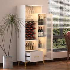 a white cabinet with wine bottles on it in a living room next to a window